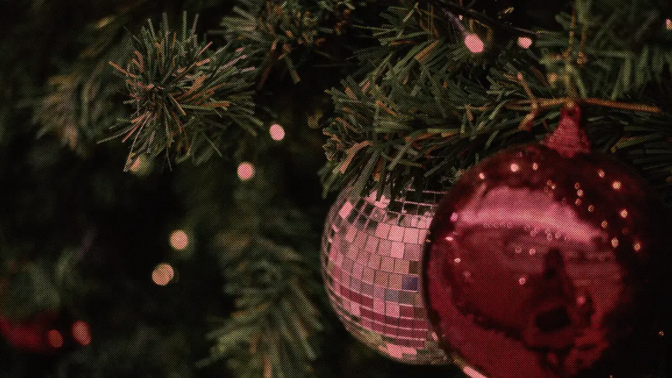 Christmas ornaments on a lit tree