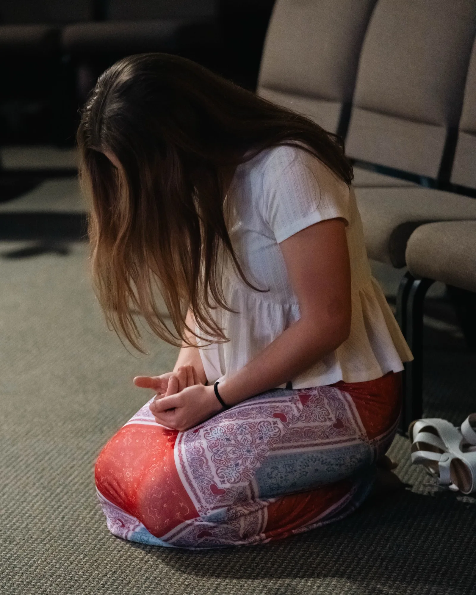 A Victory Church member in prayer